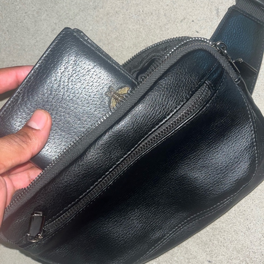 A men’s leather cross bag included with a Gucci Wallet Combo!